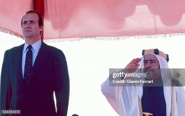 During a State visit, King Juan Carlos I of Spain is greeted at the airport by Emir Isa bin Salman Al Khalifa, Manama, Bahrain, December 1981.