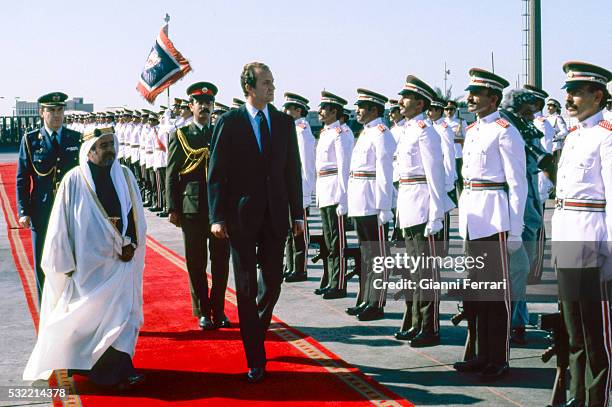 During a State visit, King Juan Carlos I of Spain is greeted at the airport by Emir Isa bin Salman Al Khalifa, Manama, Bahrain, December 1981.