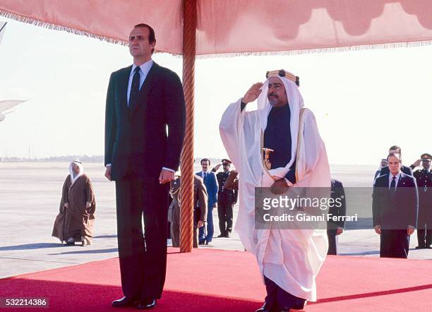During a State visit, King Juan Carlos I of Spain is greeted at the airport by Emir Isa bin Salman Al Khalifa, Manama, Bahrain, December 1981.