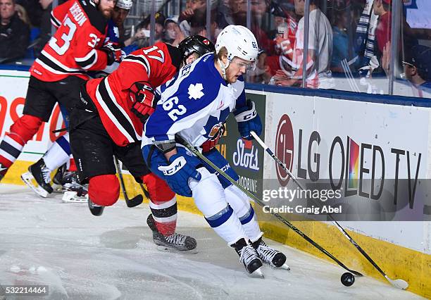 William Nylander of the Toronto Marlies controls the puck past Marc-Andre Gragnani of the Albany Devils during the Toronto Marlies 4-3 win in AHL...