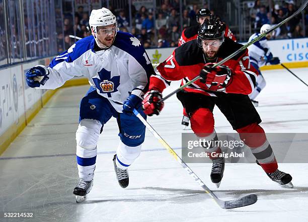 Zach Hyman of the Toronto Marlies skates up ice with Marc-Andre Gragnani of the Albany Devils during the Toronto Marlies 4-3 win in AHL playoff game...