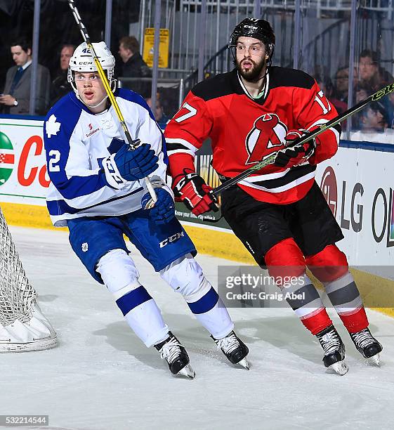 Kasperi Kapanen of the Toronto Marlies turns up ice with Marc-Andre Gragnani of the Albany Devils during the Toronto Marlies 4-3 win in AHL playoff...