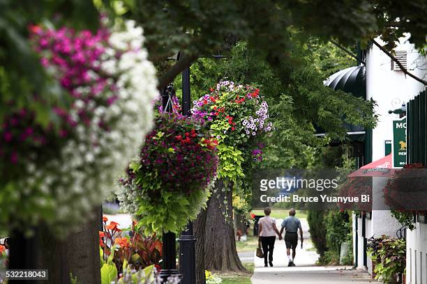 flowers decorated street of town - niagara on the lake stock pictures, royalty-free photos & images