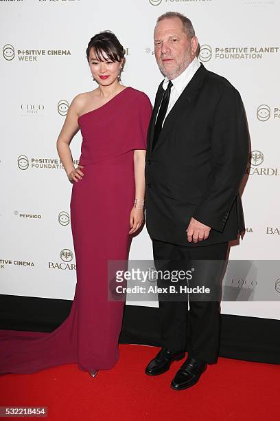 Harvey Weinstein and a guest attend the Planet Finance Foundation Gala Dinner during the 69th annual Cannes Film Festival at Hotel Martinez on May...