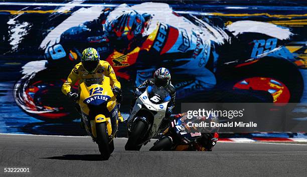 Troy Bayliss of Australia on his Honda Pons, Makoto Tamada of Japan on his Konica Minolta Honda, and John Hopkins of the USA on his Red Bull Suzuki...