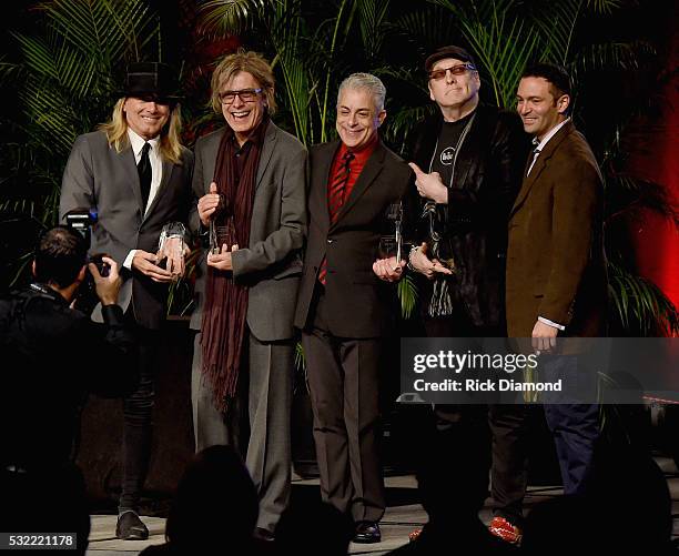 Cheap Trick's Robin Zander, Tom Petersson and Rick Nielsen receive the Chairman's Award for Sustained Creative Achievement from James Donio President...