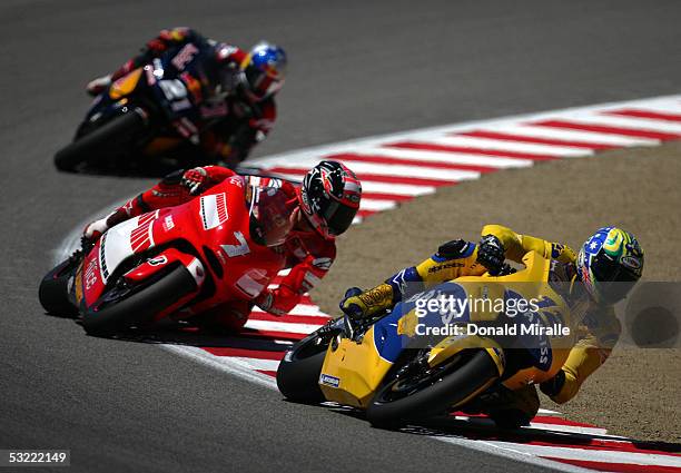 Troy Bayliss of Australia on his Honda Pons, Carlos Checa of Spain on his Team Ducati and John Hopkins of the USA on his Red Bull Suzuki race for...