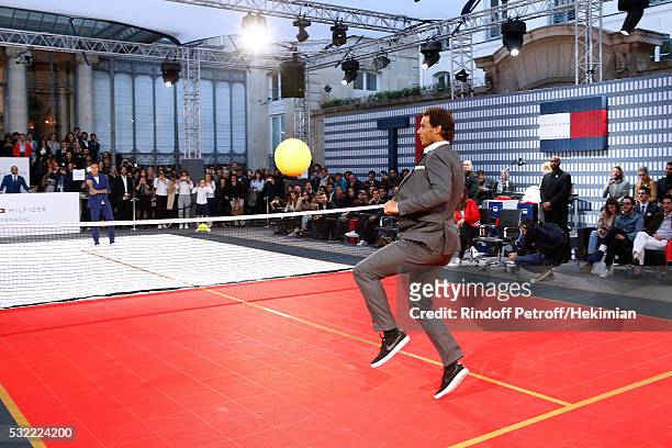 Football player Gregory van der Wiel and Tennis player Rafael Nadal compete during Tommy Hilfiger hosts Tommy X Nadal Party - Tennis Soccer Match on...
