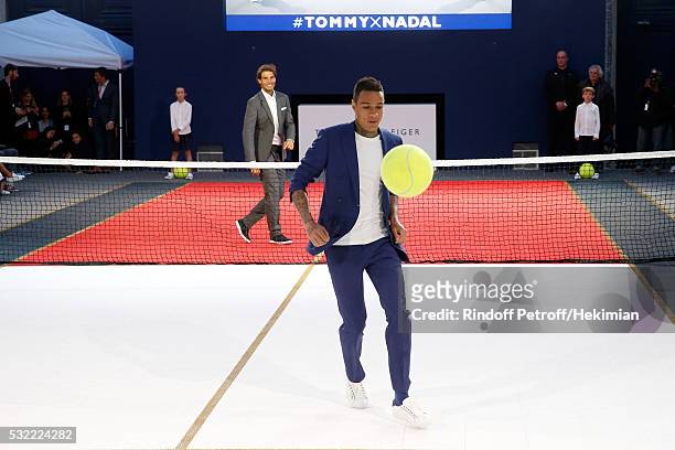Tennis player Rafael Nadal and Football player Gregory van der Wiel compete during Tommy Hilfiger hosts Tommy X Nadal Party - Tennis Soccer Match on...