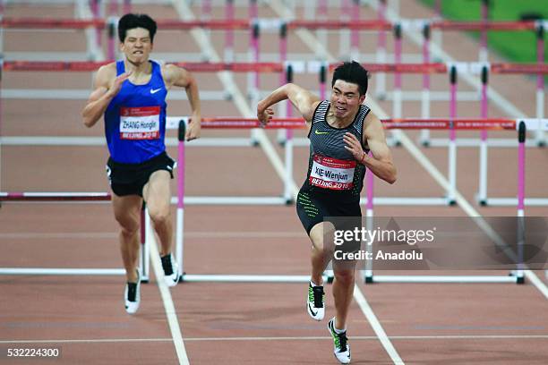 Xie Wenjun of China runs in the Men's 100m hurdles during the Beijing IAAF World Challenge at National Stadium on May 18, 2016 in Beijing, China.