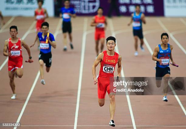 Zhang peimeng of China runs in the Men's 4x100m Relay during the Beijing IAAF World Challenge at National Stadium on May 18, 2016 in Beijing, China.