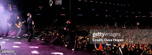 Musicians Andy Dunlop, Fran Healy and Dougie Payne of Travis perform on stage at the Live 8 Edinburgh concert at Murrayfield Stadium on July 6, 2005...