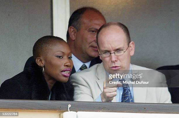 Prince Albert of Monaco chats with Nicole Coste as they watch a match from his private box at the Monaco Tennis Open in April 2002 in Monaco. Prince...