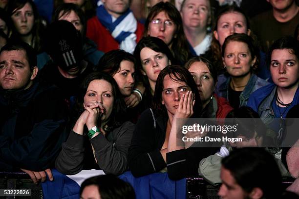 The crowd watch an African report on screen at the Live 8 Edinburgh concert at Murrayfield Stadium on July 6, 2005 in Edinburgh, Scotland. The free...