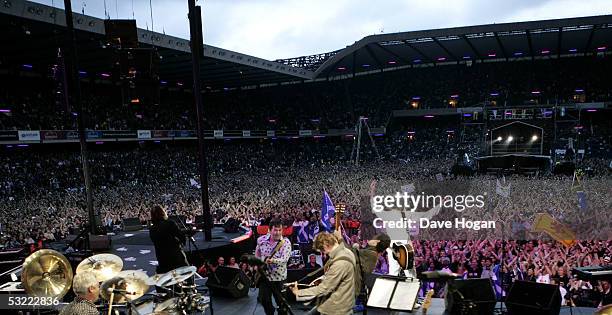 Musician Sir Bob Geldof performs on stage at the Live 8 Edinburgh concert at Murrayfield Stadium on July 6, 2005 in Edinburgh, Scotland. The free...