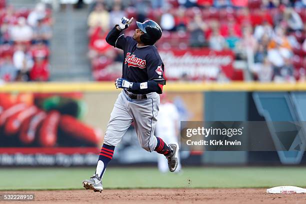 Rajai Davis of the Cleveland Indians celebrates his solo home run while rounding second base during the top of the third inning of the game against...