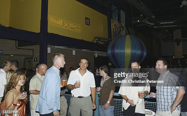 People mingle during the Stuff Magazine Technology XPO at the Detroit Science Center on July 10, 2005 in Detroit, Michigan.