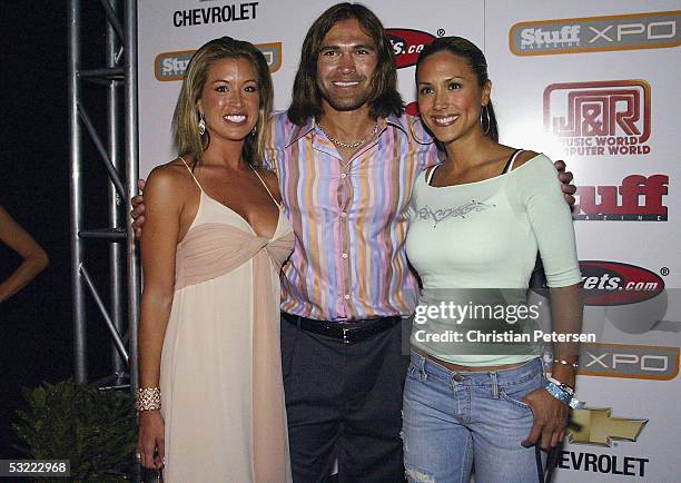 Michelle Damon, MLB athlete Johnny Damon and Leeane Tweeden pose for a photograph at the Stuff Magazine Technology XPO at the Detroit Science Center...