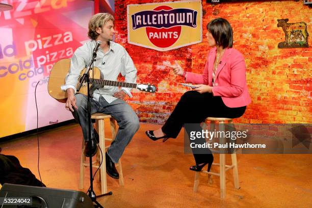 Boston Red Sox pitcher Bronson Arroyo is interviewed by show host Dana Jacobson before performing a song from his new CD "Covering the Bases" at...