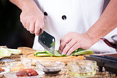 Chef chopping vetable before cooking noodle