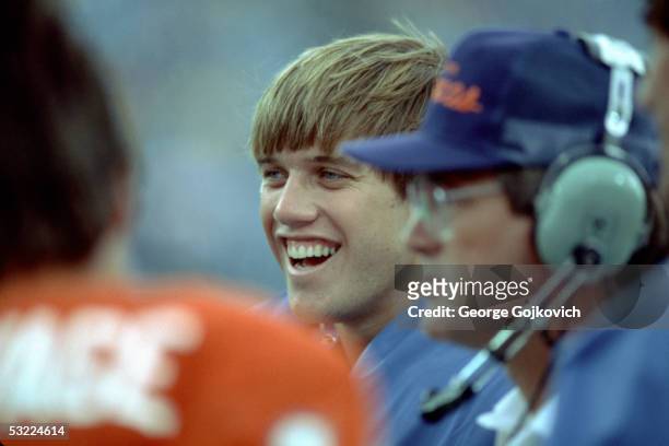 Quarterback John Elway of the Denver Broncos smiles during a game against the Buffalo Bills at Rich Stadium on October 21, 1984 in Orchard Park, New...