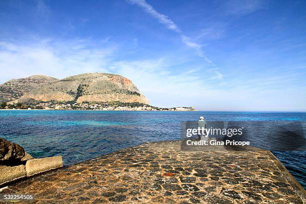 fisherman at mediterranean sea, sicily italy - mondello stock-fotos und bilder