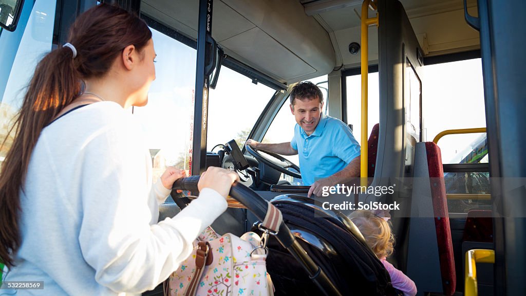 Mother and Baby Getting on Bus