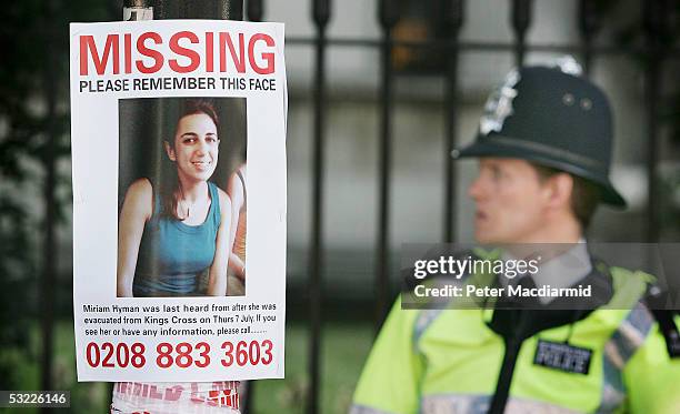 Poster of a missing person attached to a pole is seen near the site of the Tavistock Square bus bomb on July 12, 2005 in London. A massive police...