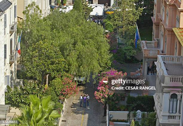 Policemen search in front of the Italian Cultural Institute after a small bomb exploded early 12 July 2005, outside the Italian cultural center in...