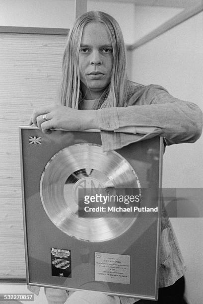 English keyboard player and composer Rick Wakeman, with an award from A&M Records for sales of his album 'Journey To The Centre Of The Earth', 10th...
