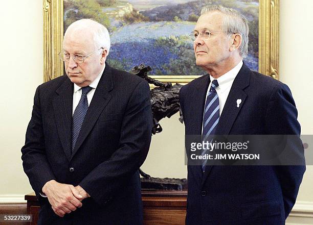 Washington, UNITED STATES: US Vice President Dick Cheney and US Defense Secretary Donald Rumsfeld look on as US President George W. Bush meets with...