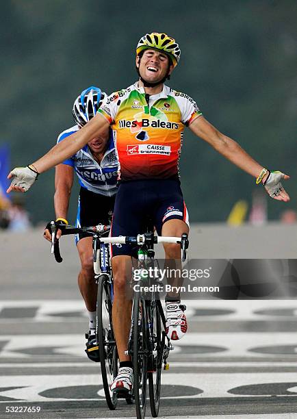 Alejandro Valverde of Illes Balears crosses the finish line to win Stage 10 as Lance Armstrong of the U.S. And Discovery Channel team finishes second...