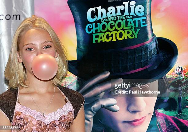 Actress AnnaSophia Robb from the new movie "Charlie and the Chocolate Factory" blows a bubble as she hosts a bubble blowing contest at Planet...