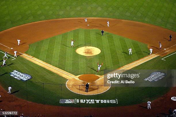 The Boston Red Sox players celebrate after Edgar Renteria of the St. Louis Cardinals grounded out against pitcher Keith Foulke of the Boston Red Sox...