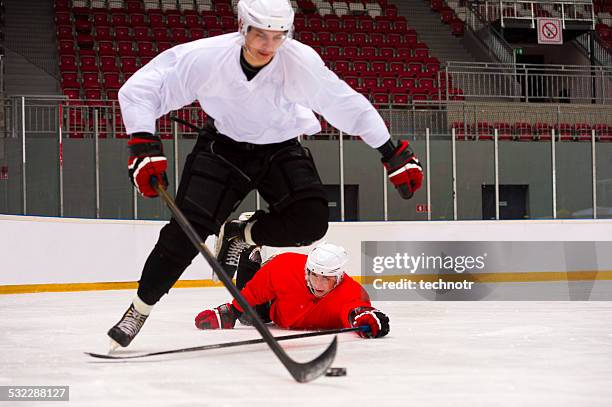 two ice hockey players in a hard duell - duell stock pictures, royalty-free photos & images