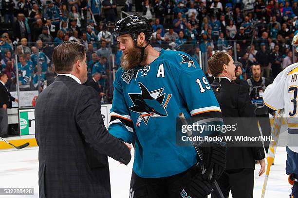 Joe Thornton of the San Jose Sharks shakes hands with Head coach Peter Laviolette of the Nashville Predators after the game in Game Seven of the...