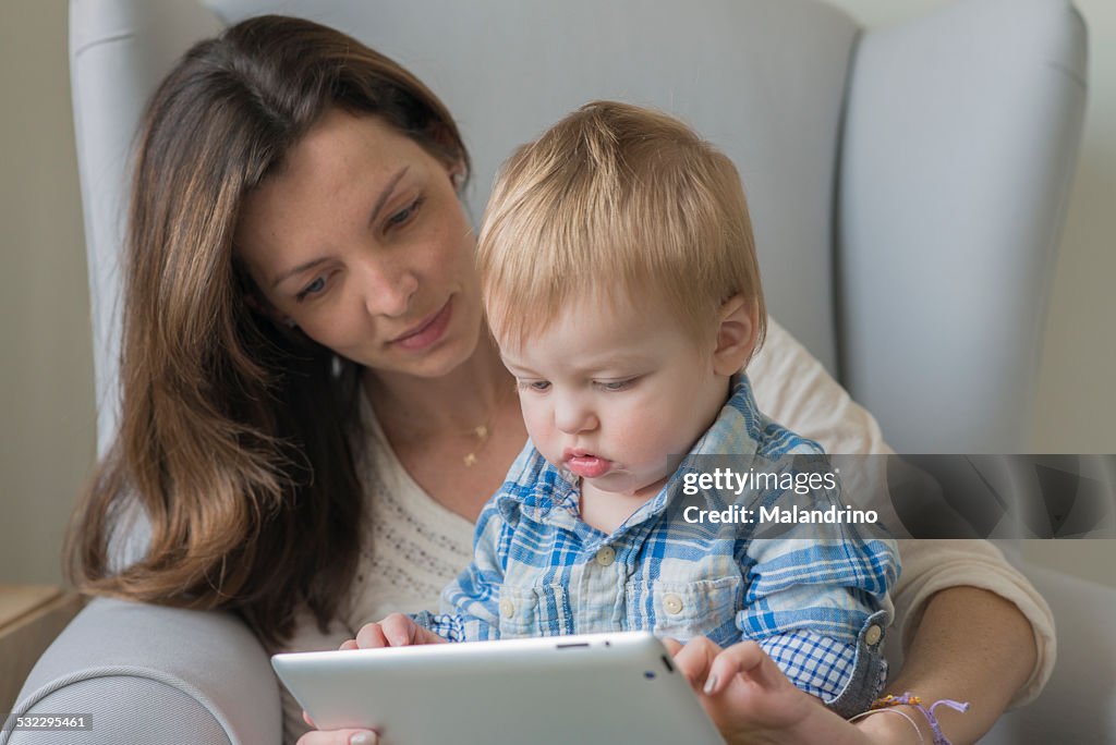 Mother and son looking at a tablet
