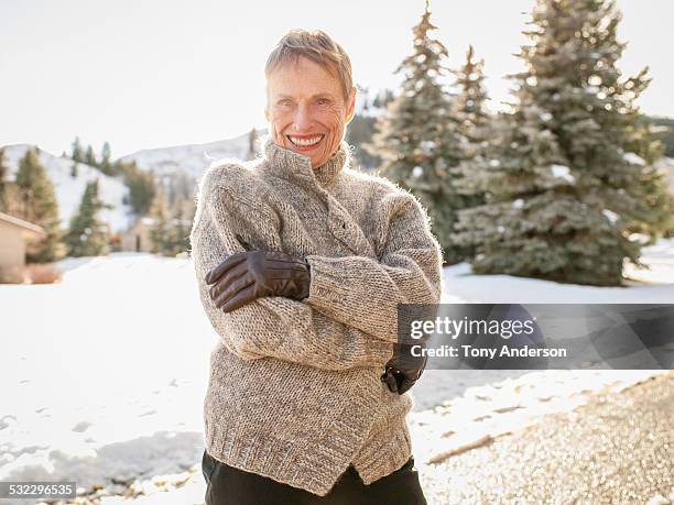 senior woman outdoors in winter - wol stockfoto's en -beelden