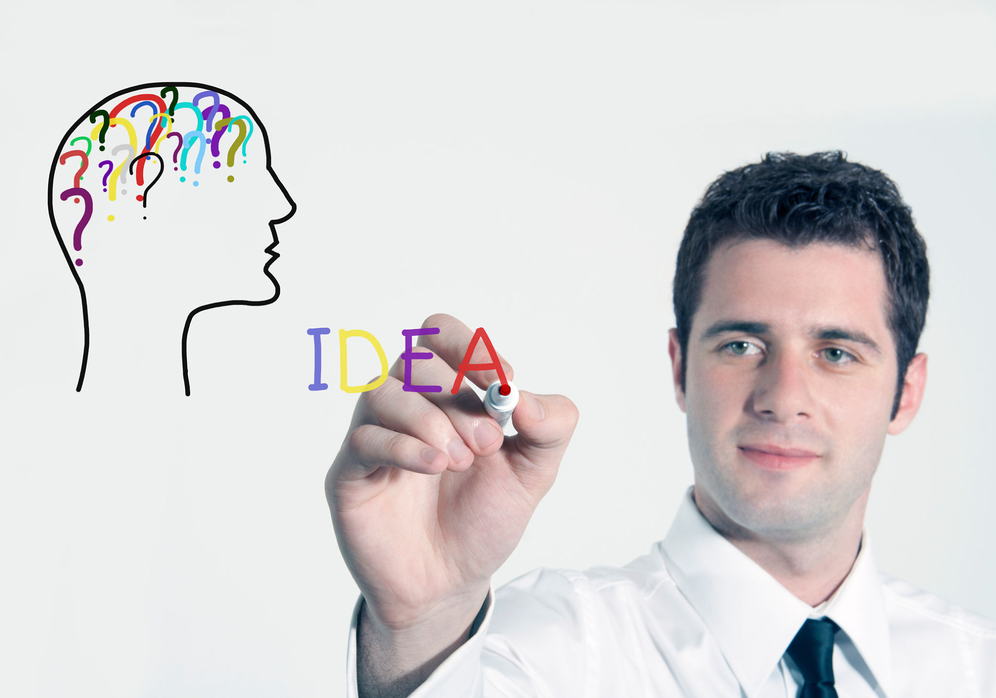 Young Businessman Drawing a Question Mark Young Businessman Drawing a Question Mark