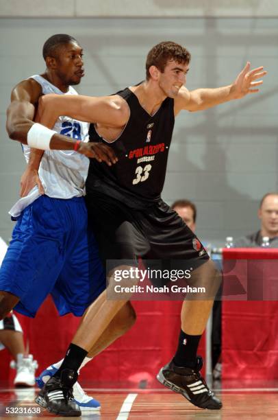 Nedzad Sinanovic of the Portland Trail Blazers works against D.J. Mbenga of the Dallas Mavericks during the NBA Vegas Summer League on July 10, 2005...