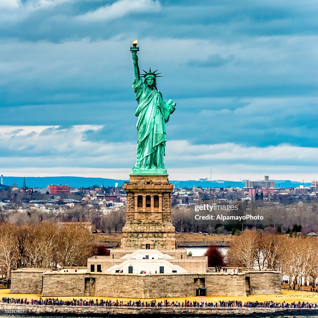 Statue of Liberty with Jersey City in the background