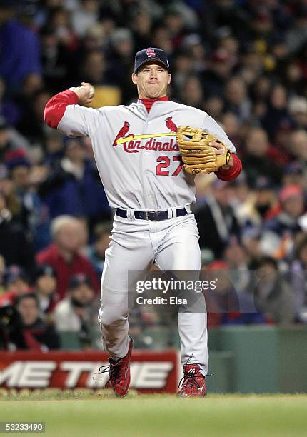 Scott Rolen of the St. Louis Cardinals throws the ball against the Boston Red Sox during game one of the 2004 World Series on October 23, 2004 at...