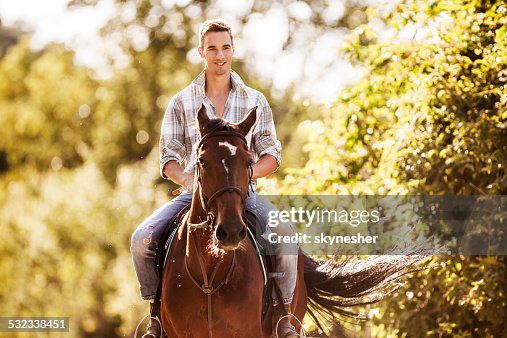 Man Riding Rocking Horse Young Man Riding Horse High-Res Stock Photo - Getty Images