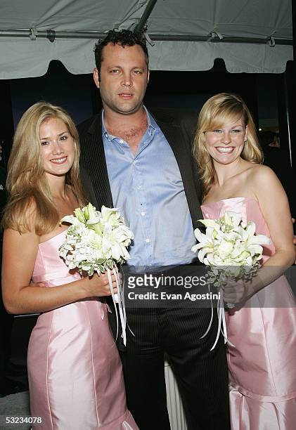 Actor Vince Vaughn poses with "bridesmaids" Heidi Bailey and Amelia Nelson at the premiere of "Wedding Crashers" at the Ziegfeld Theatre July 13,...