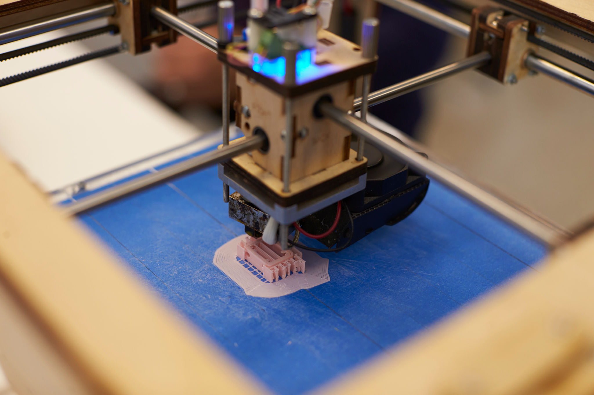 Close Up Of 3D Printer Operating In Design Studio Close Up Of 3D Printer Operating In Design Studio