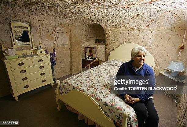 Judy McLean displays the subterranean bedrooms of Faye's underground house in the opal mining town of Coober Pedy, 05 July 2005, located 840 kms...