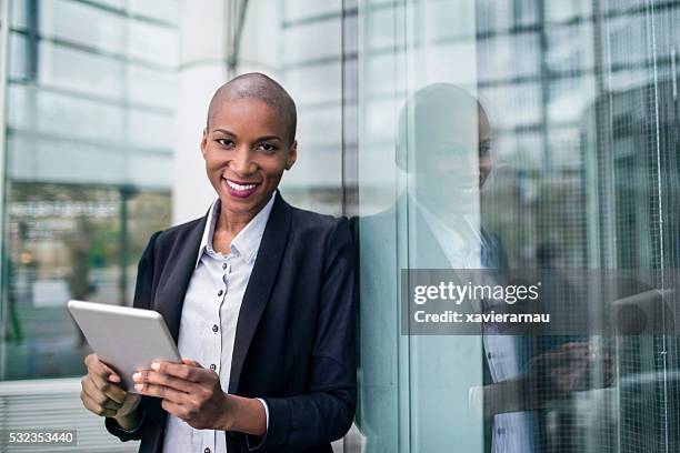 business woman portrait using a digital tablet - shaved head stock pictures, royalty-free photos & images