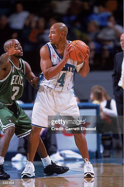 David Wesley of the Charlotte Hornets guards the ball against Kenny Anderson of the Boston Celtics during the pre-season game at the Charlotte...