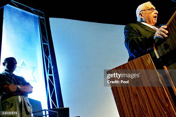 Israeli Prime Minister Ariel Sharon smiles during a meeting with Israeli police commanders on July 14, 2005 in the costal city of Ashdod, Israel....