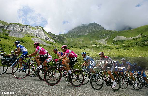 Andreas Kloden of Germany riding for the T-Mobile cycling team in the pink jersey, Jan Ullrich of Germany and Ivan Basso of Italy riding for the CSC...